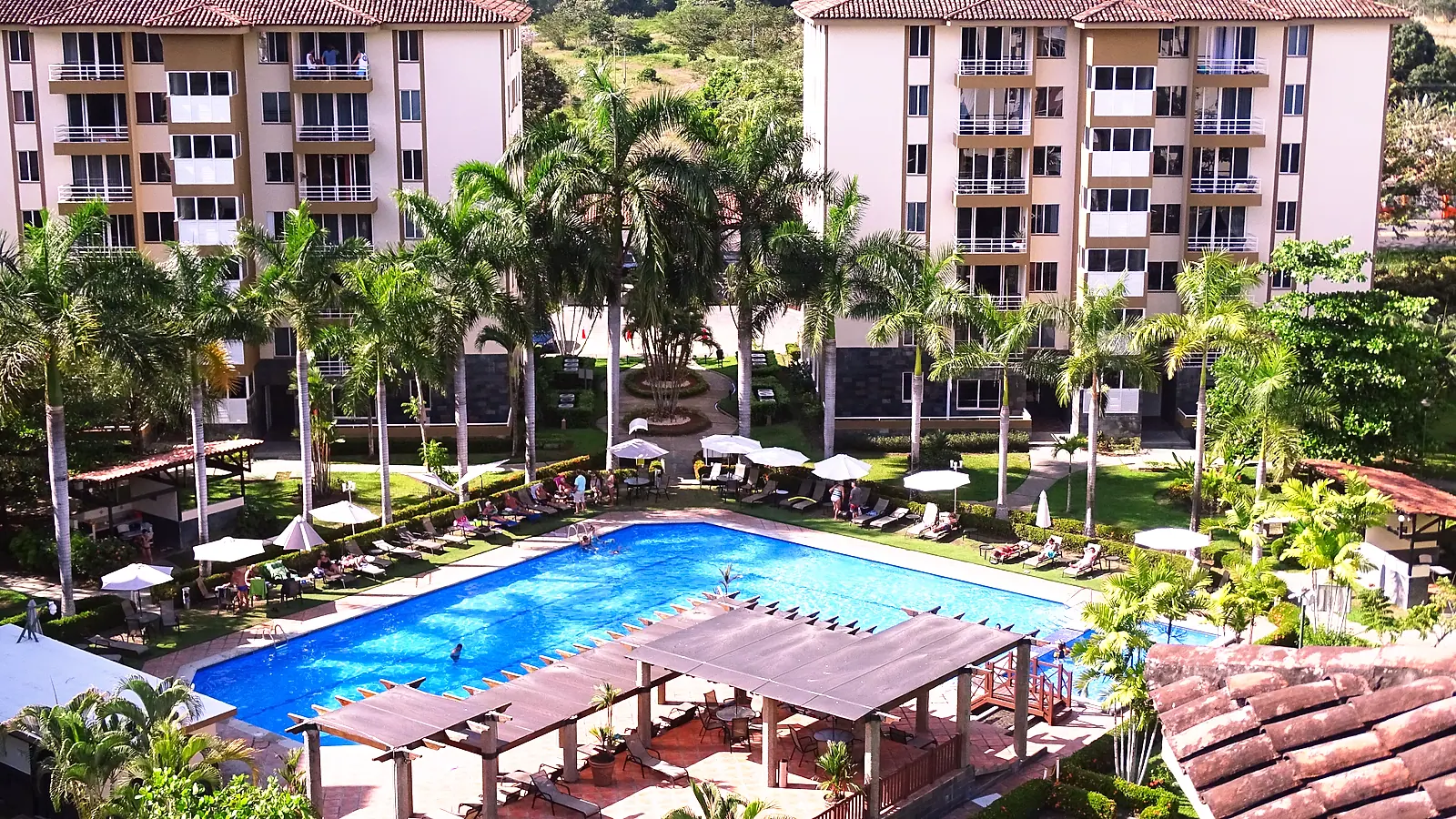 The pool and the sun terrace, seen from a balcony